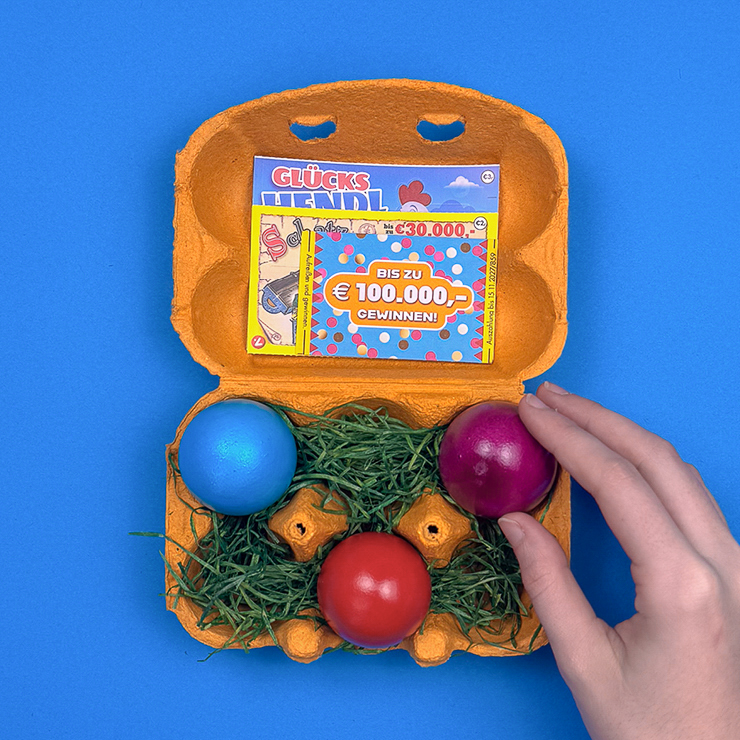 Ein Bild das zeigt, wie die Ostereier in die Fächer gelegt werden.